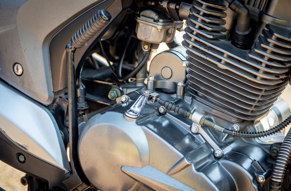 Detailed view of a motorcycle engine showing components and metal textures.