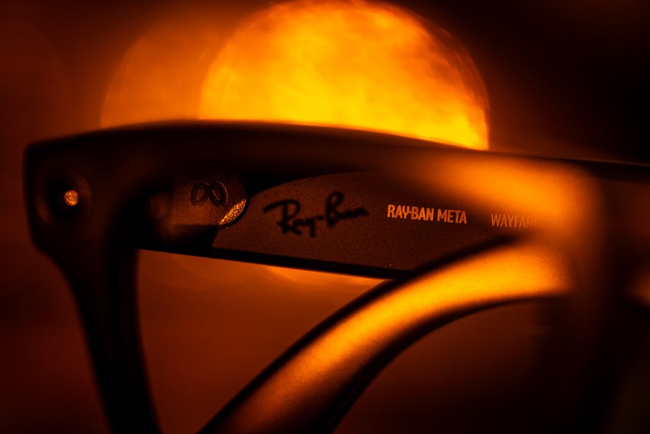 Artistic close-up of designer sunglasses featuring golden, warm lighting.
